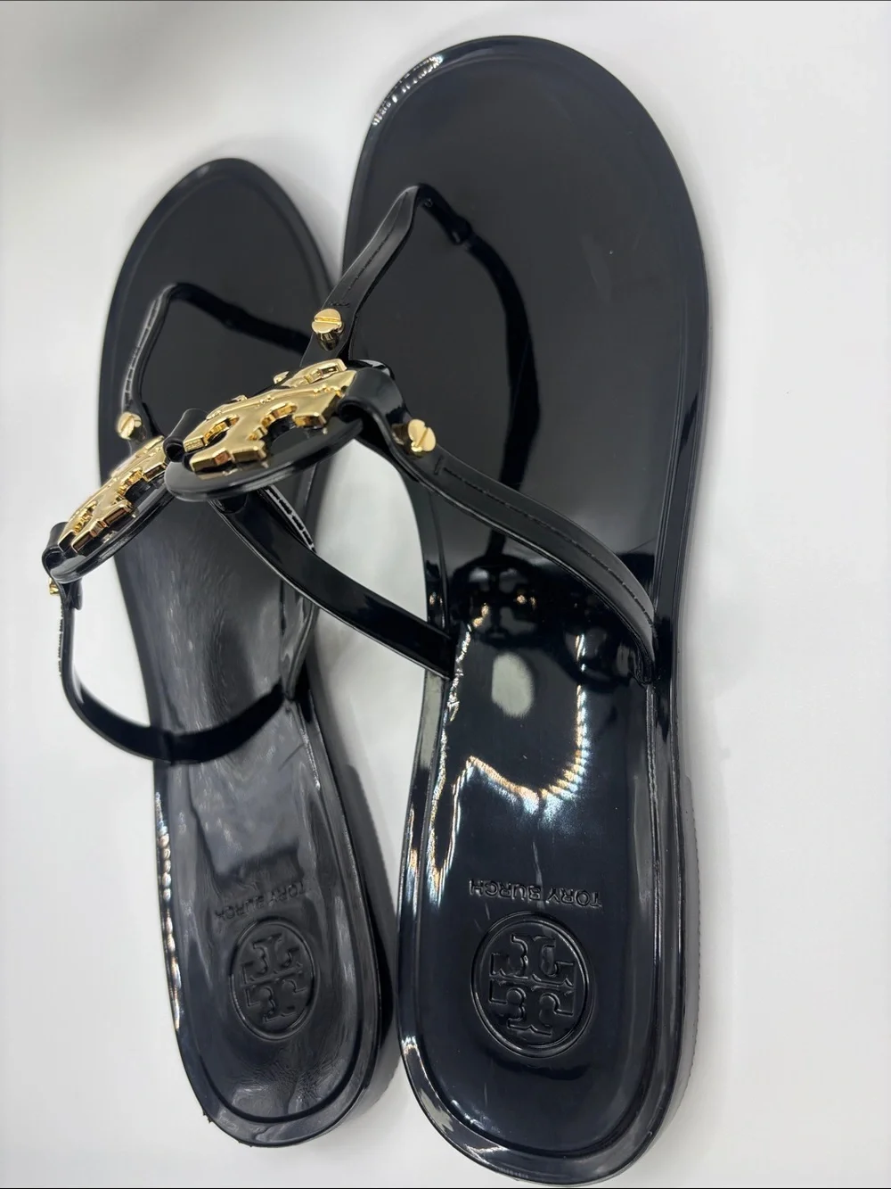 Tory Burch Black Jelly Thong Sandals with Gold Logo Medallions